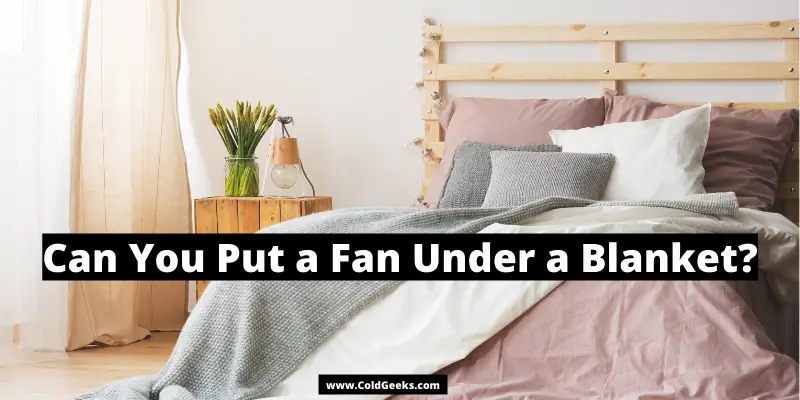 Bed in bedroom—Can You Put a Fan Under a Blanket