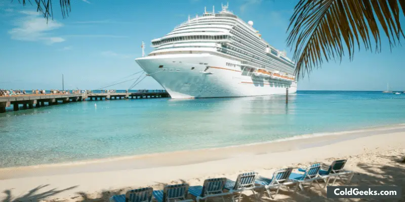 Cruise ship docked by a beach—Can You Take a Fan on a Cruise