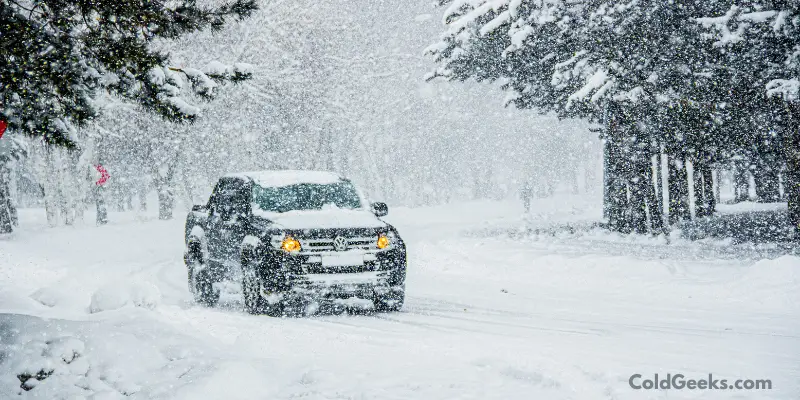 Black truck in snow—What Color Car Is Best for Cold Weather