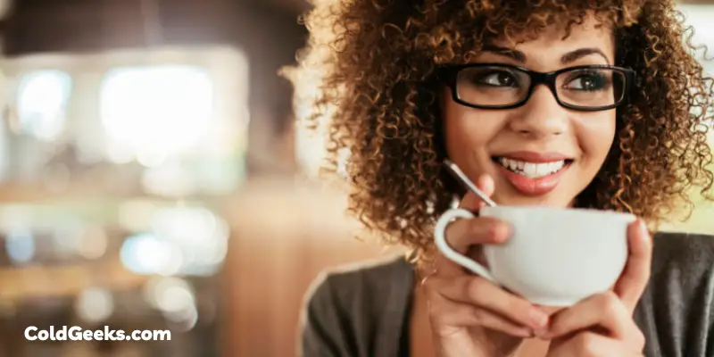 Woman drinking coffee - Is Coffee Good for Cold Weather