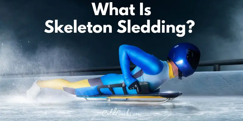 Photo of a man with a helmet laying on a skeleton sled - What Is Skeleton Sledding